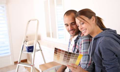 A couple decorating their new apartment.